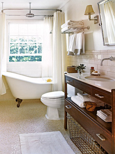 Clawfoot tub and shower in front of window