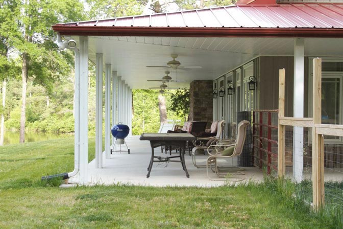 A wrap-around porch with a beautiful light system installed.