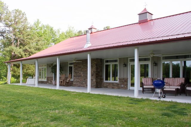 Step onto the spacious porch with white columns and enjoy the fresh air.