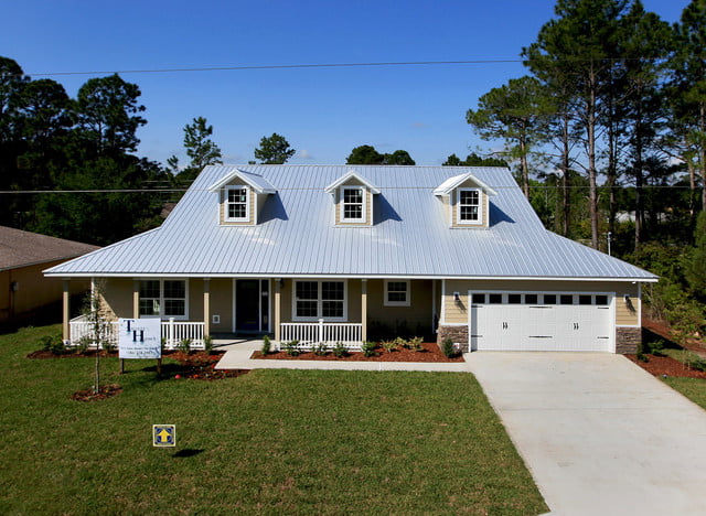 The front view of the 2,410 Sq. Prefab Farmhouse, highlighting the roof and dormer windows.