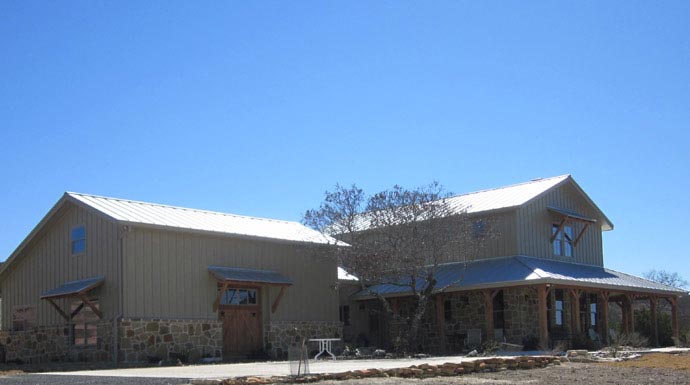 This image shows the exterior of a ranch style home bathed in sunlight.