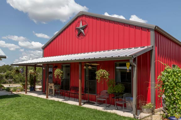 This beautiful home's exterior is a stunning shade of red, adding a bold touch to the home's curb appeal.