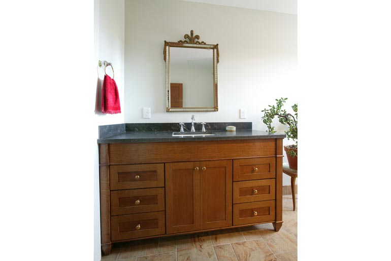 This modern bathroom boasts a sleek vanity sink, perfect for getting ready in the morning.