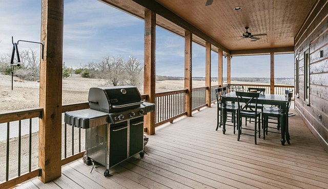 The wide porch is well-suited for barbecues in any weather. 