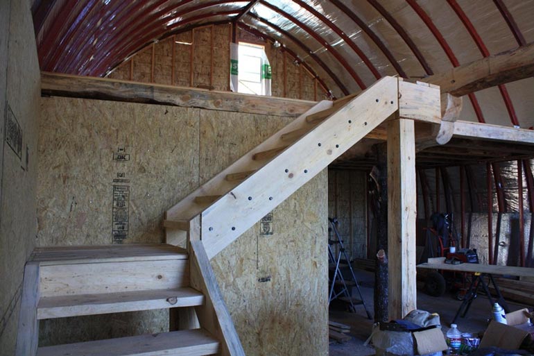 Construction phase of the Arched Metal Cabin interior.