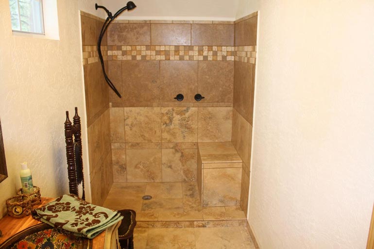 The tiled shower in the Arched metal cabin.