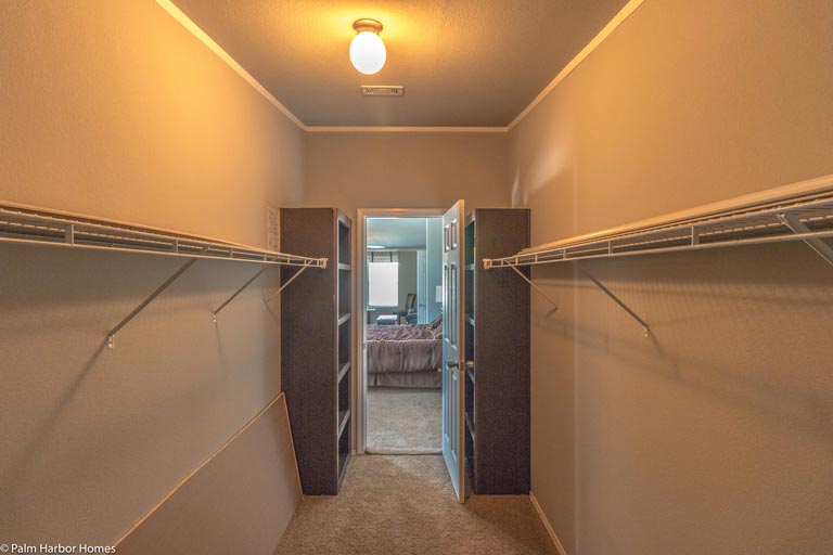 The walk-in closet provide ample storage space.
