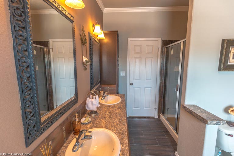 The bathroom is a functional yet stylish space, with everything a person might need to get ready for the day.