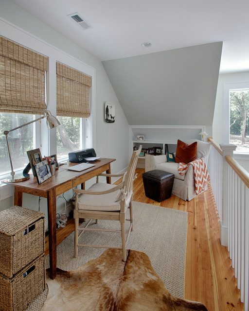 The loft space, utilized for desk or leisure use.