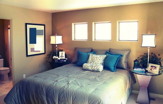 Bedroom with a queen-sized bed between two nightstands.