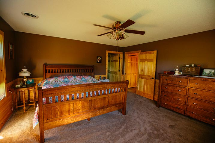 This cozy bedroom features warm, earthy colors that create a welcoming atmosphere.