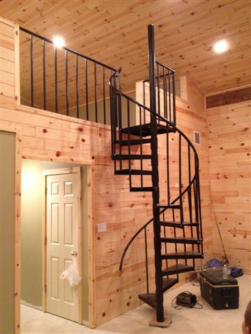 The spiral stairs of the metal pole barn home.
