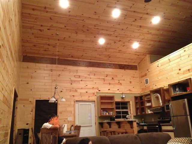 The living-dining room of the cozy metal pole barn home.