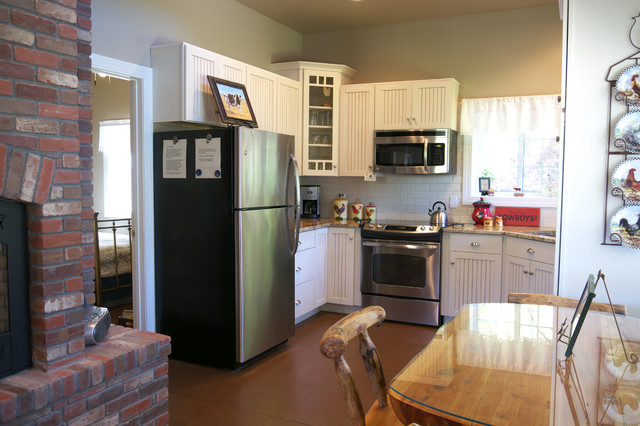 The kitchen area provides sufficient space for functionality and efficiency in cooking.