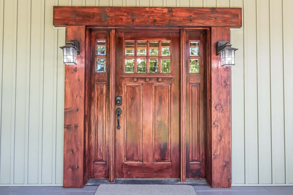 The door to the Beautiful Dutch Saltbox Home gives off a vintage feel.