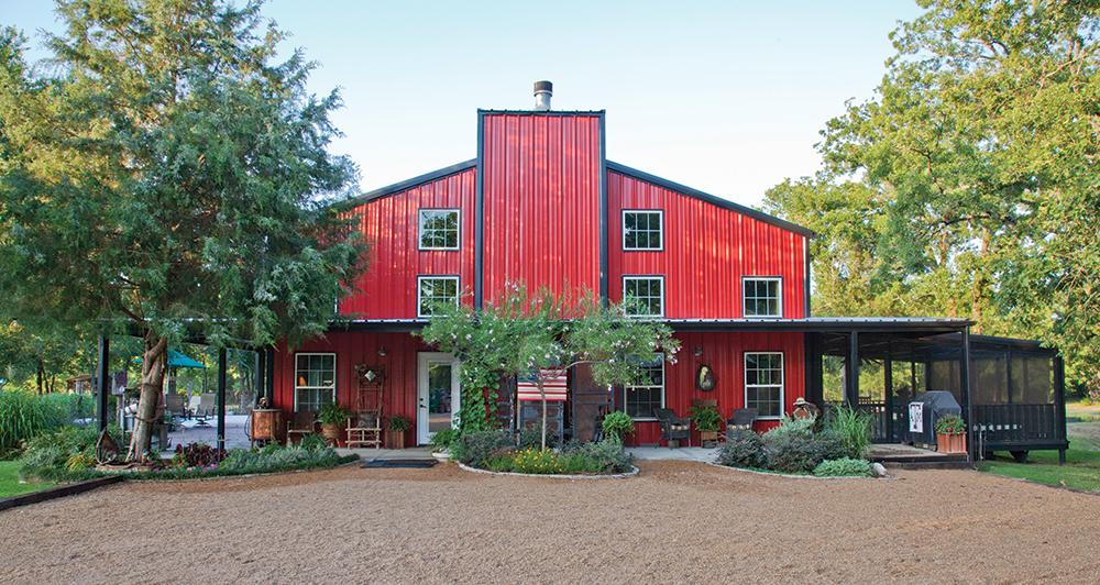 A large metal building home in a red color scheme from Mueller Buildings