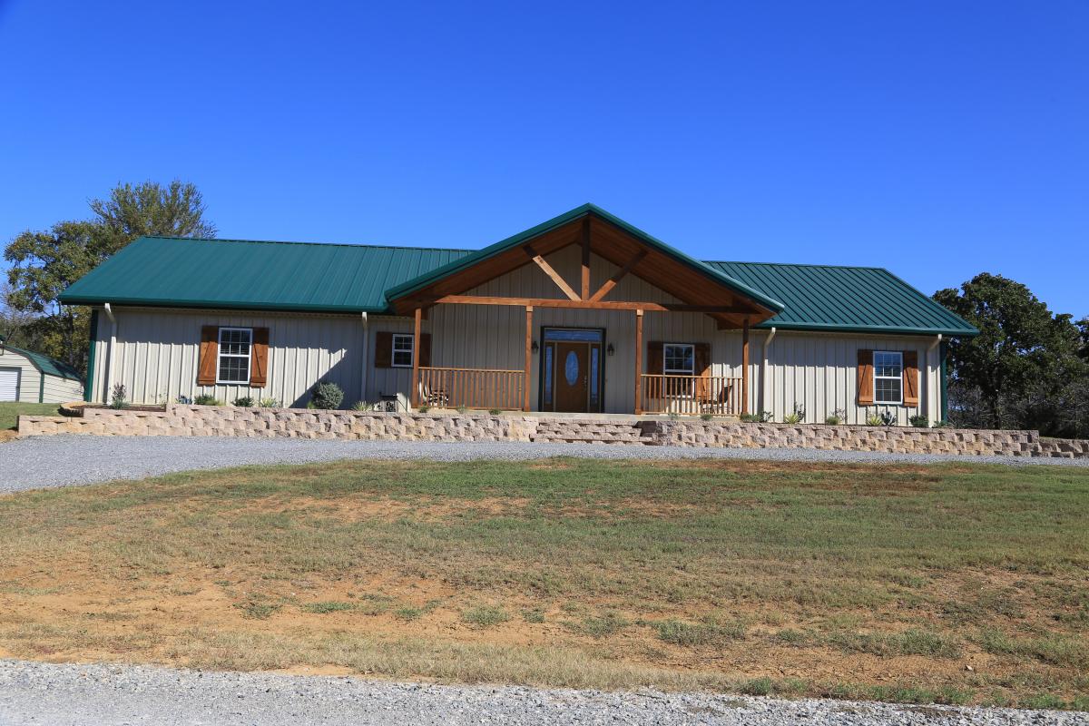 Front view of a metal building home with gabled roof from Mueller Inc