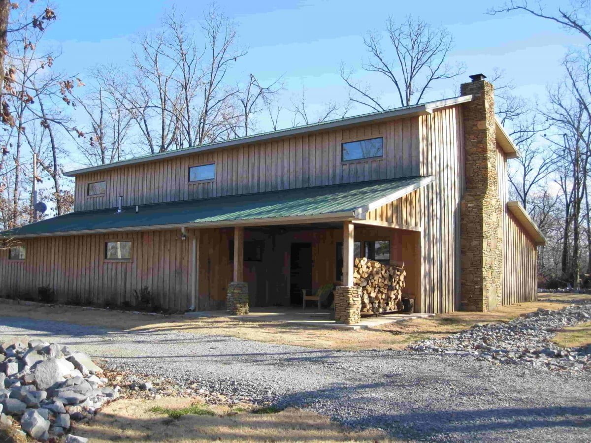 Completed timber prefab pole barn home kit by Hansen Pole Buildings in autumn