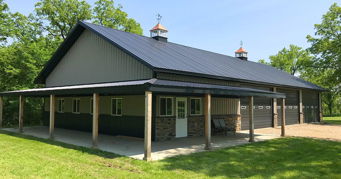 Angled front left view of a single story garage home with gabled roof from world steel buildings