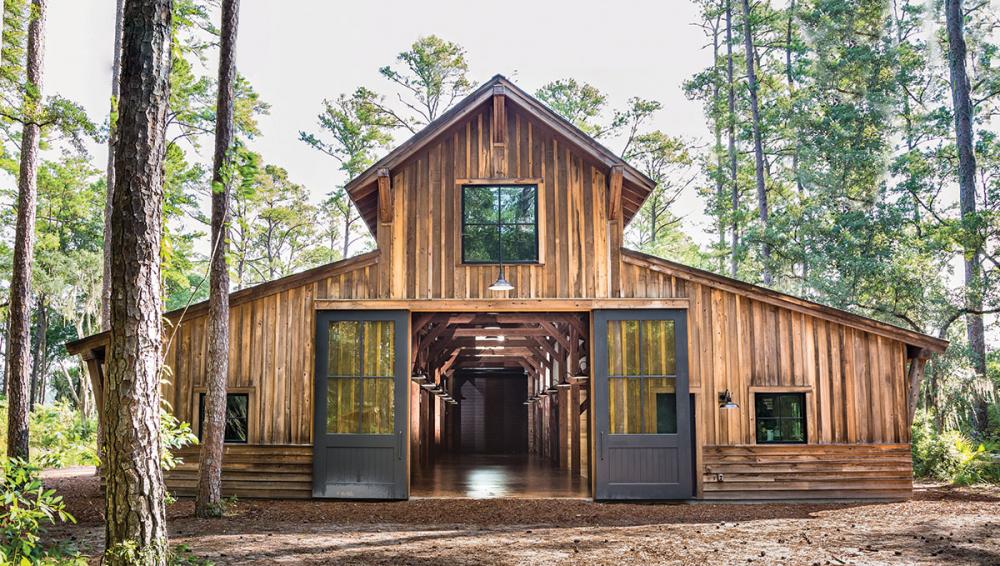 A great example of a timber-trame monitor style amish pole barn erected by New Energy Works.