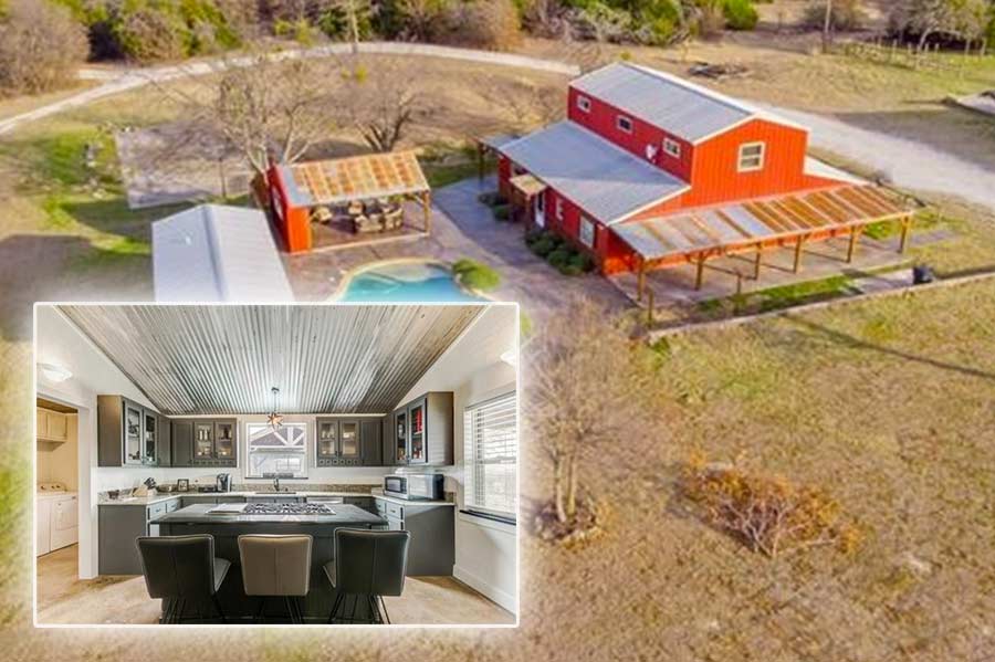 Red Monitor style pole barn home featuring epic metallic kitchen interior.