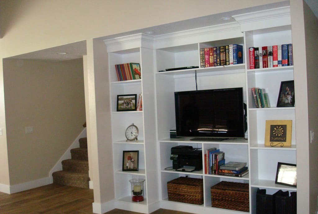 Living Room with stairs to the second floor, and a bookshelf 