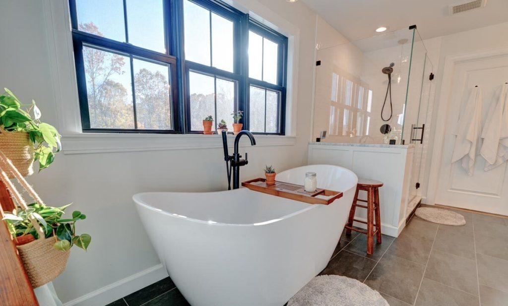 Bathroom with a free-standing bathtub and a walk-in shower.