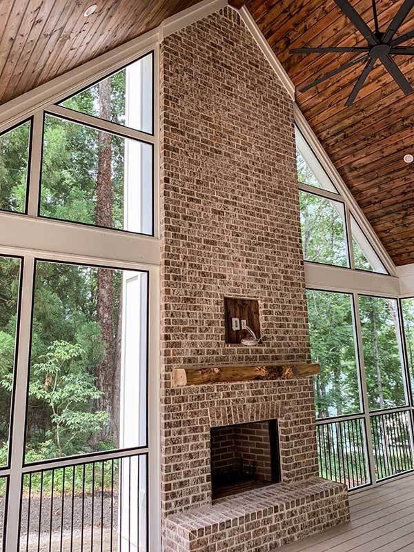 View of the Fireplace in the screened porch.