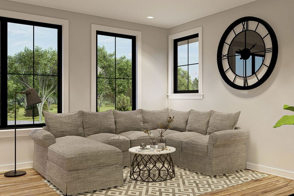 3D view showing the living room with soft sofas, a coffee table at the center, a big clock, a three window looking outside.