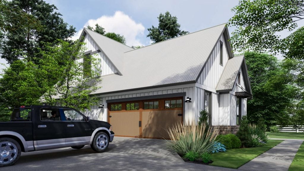 Left-side angled view of the homestead. showcasing 2-car garage entrance.
