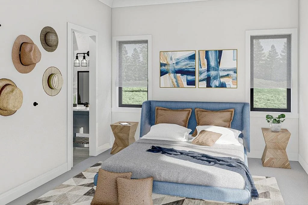 Bedroom with a full-size bed, nightstand table, mounted artworks on the wall, and the door to the bathroom