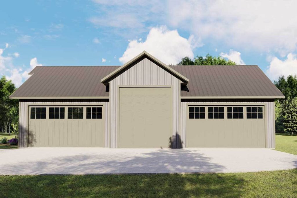 Right side exterior view of the barndominium with the two-car garage door.
