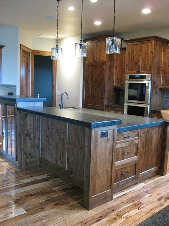 The kitchen shows marble countertops, wooden cabinets, and a simple but classy kitchen lighting.