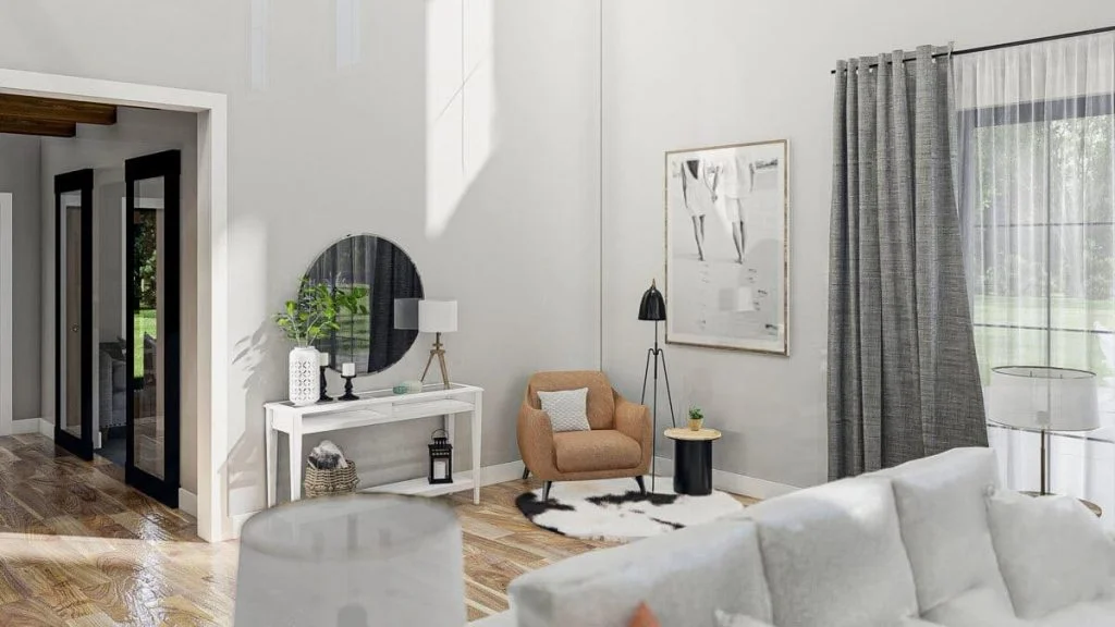 Great room with a white sofa, armchair, small table, mirror, a window, and the door of the home office