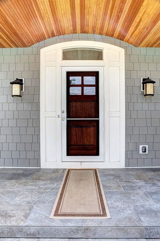 Entrance to the abode with 2 outdoor sconces.