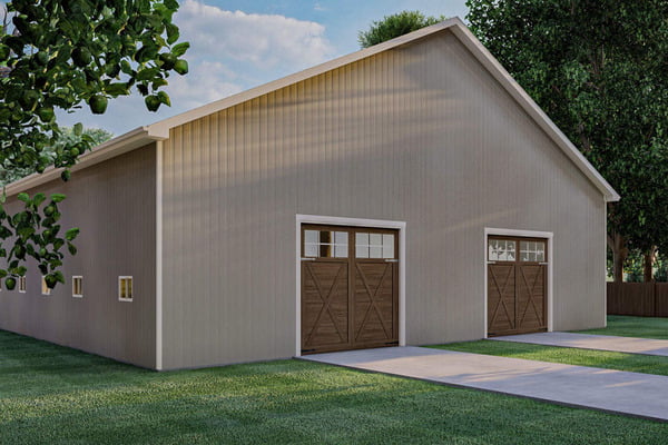 Right-rear view of the Massive Barn w/ 4-car Garage Shop showcasing the two garage doors.