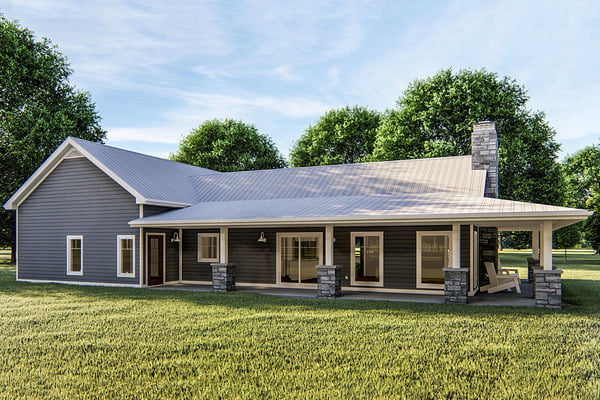 Rear view of the Impressive 1BHK Ranch Barndominium showcasing the covered wrap-around porch.