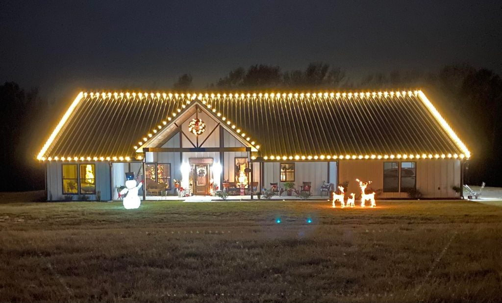 The Barndo's exterior at night with Christmas lighting.