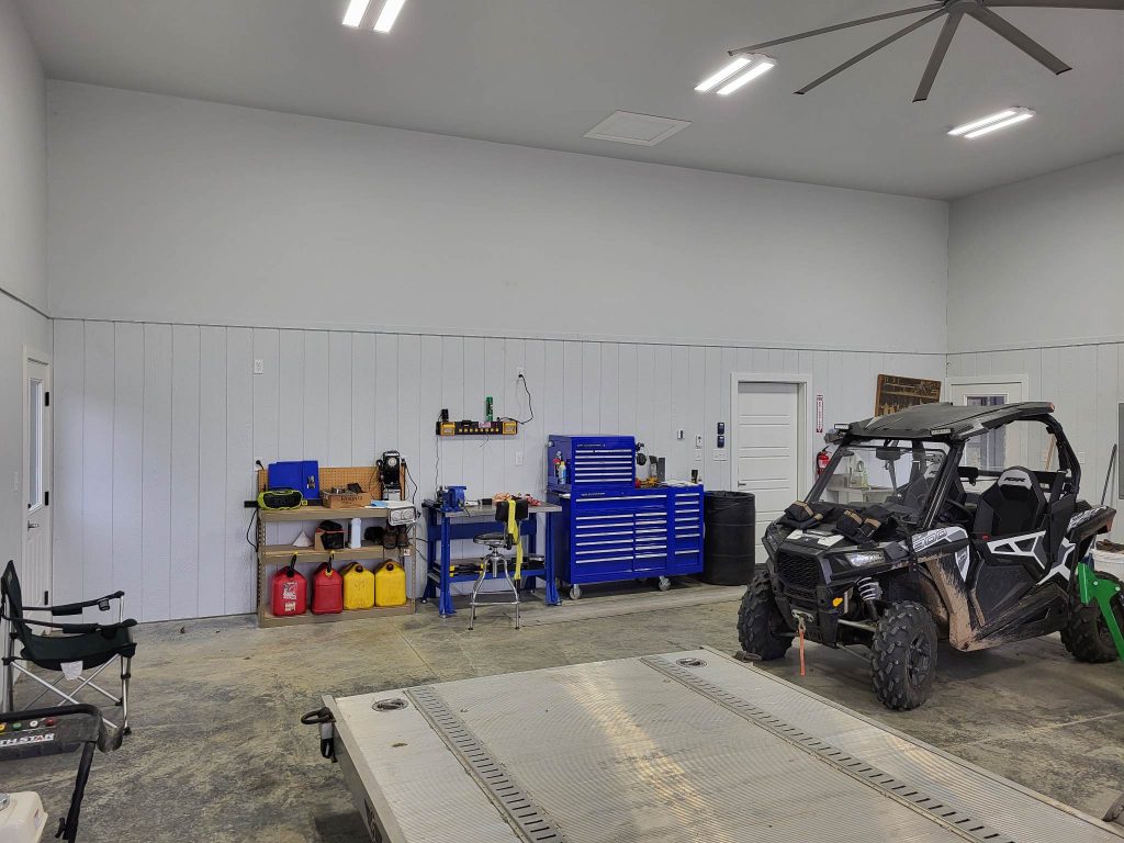Garage/Shop with mechanical tools and an ATV