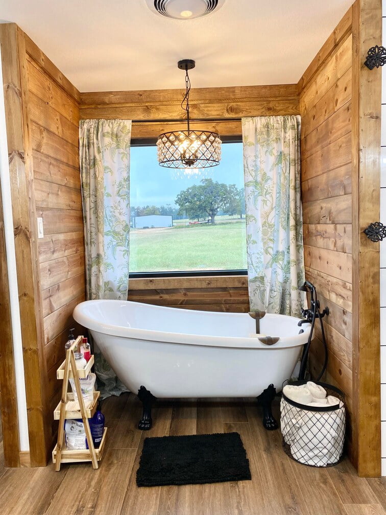 An en-suite toilet and bath with an exclusive bathtub.