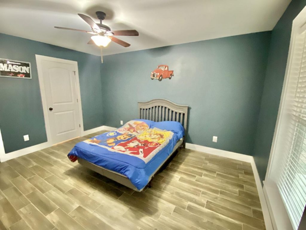 Spacious children's bedroom with a cozy bed