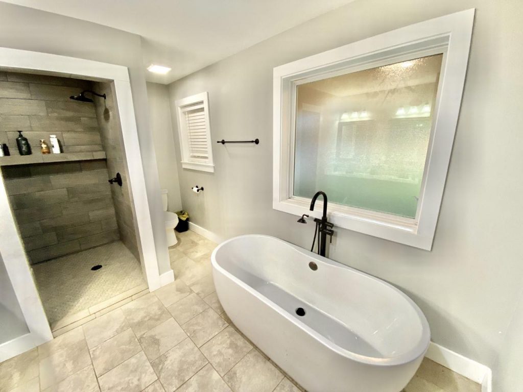 En-suite bathroom with a bathtub and separate shower.