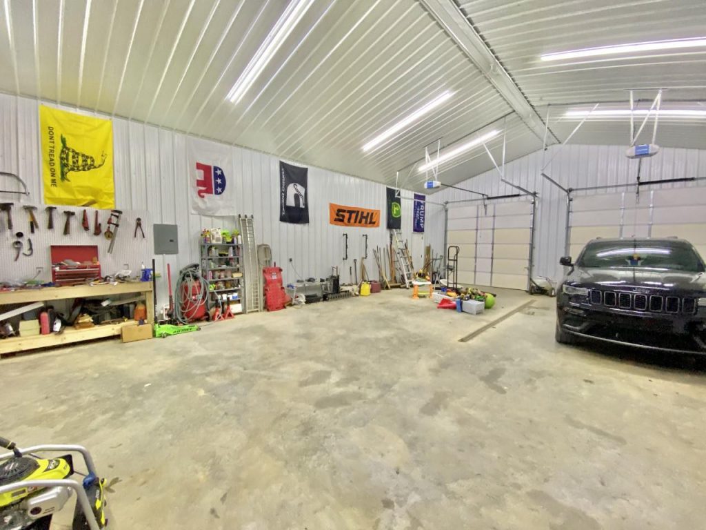The garage/workshop with Brandon's black SUV.
