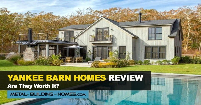 A grey Barndominium with a beautiful lawn with a pool