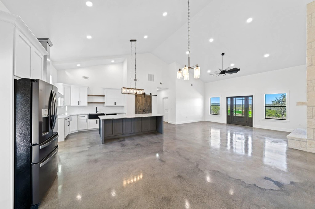 A wide polished concrete flooring kitchen