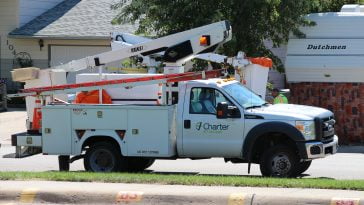 Charter Communications service bucket truck along the road