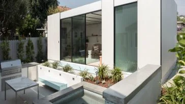 A gorgeous, sleek looking prefab home in a white motif