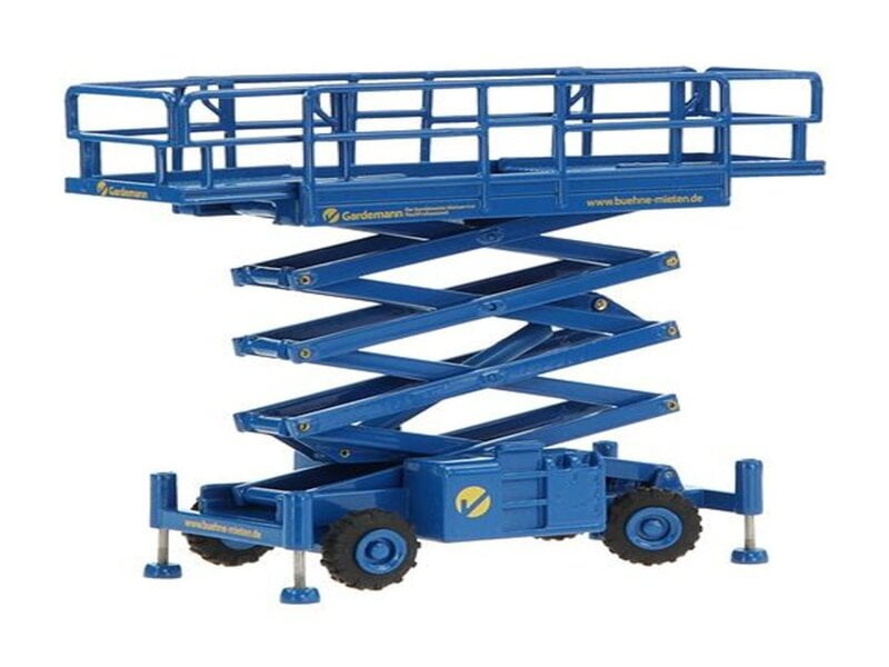  A rugged rough terrain scissor lift situated amidst a challenging outdoor landscape. The scissor lift, designed for off-road use, showcases its durability and versatility.