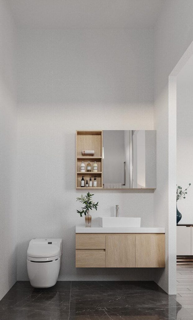 The image shows the bathroom toilet and sink with the cabinet