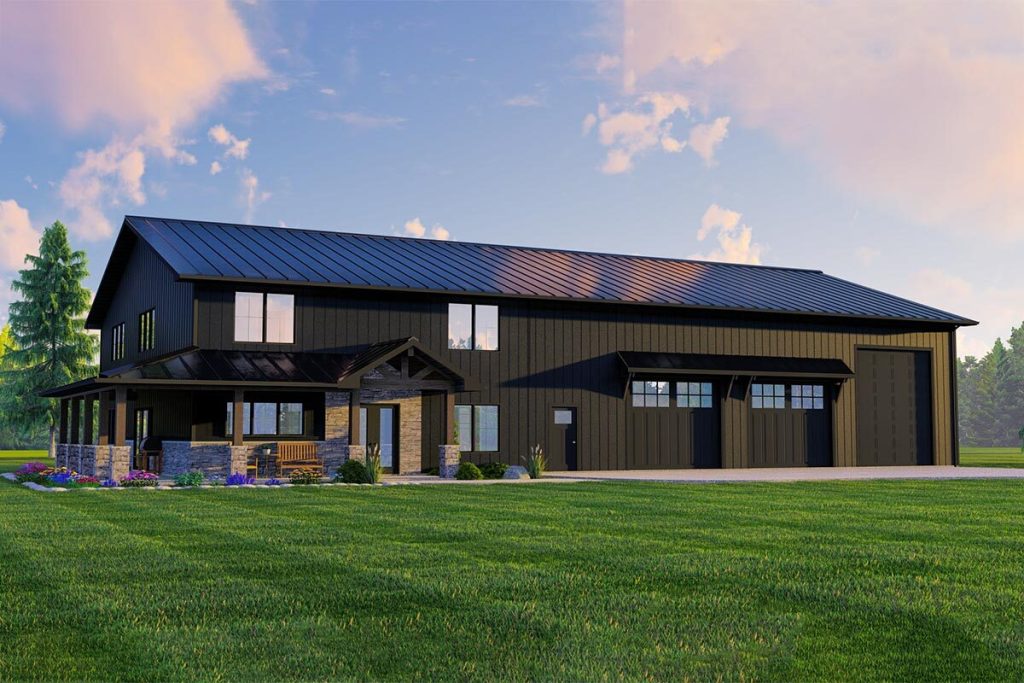 An angled left view of the Sweet 3,026 Sq. Ft. Barndominium is captured in this image. The property showcases a spacious lawn, accompanied by a covered porch that adds a touch of charm to the overall exterior. Adjacent to the barndominium, there is a 3-overhead door shop/garage that seamlessly integrates with the barn, providing convenient storage and workspace